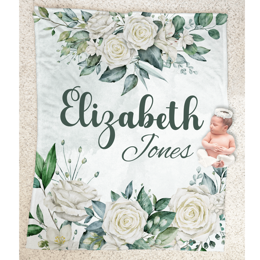 Baby girl laying on a personalized minky plush blanket featuring beautiful watercolor white roses bouquet design.